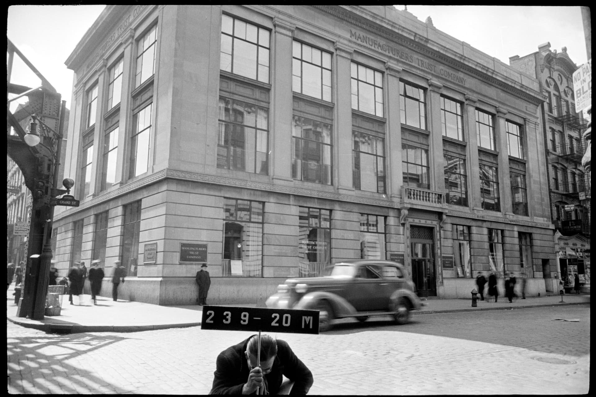 A low-rise tenement block on Amsterdam Avenue in West Harlem near West 123rd Street, photographed by the New York City Department of Taxation around 1940, about a decade before the slum-clearance demolitions that cleared the blocks for the Grant Houses and Morningside Gardens.